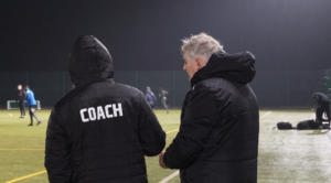 Mid shot of University of Leicester Coach Dave Bamford and his assistant.